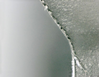 Removal of hob cutter return burrs after the machining process