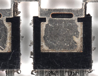 Removal of resin burrs from transistors and heat sinks